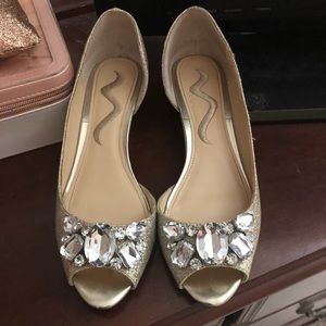 Gold, glittery formal wedges.